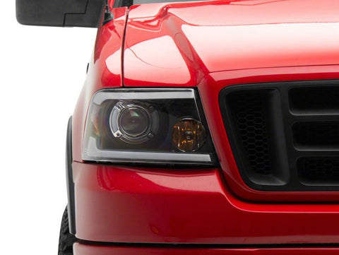 Raxiom 04-08 Ford F-150 Axial Series Projector Headlights w/ SEQL LED Bar- Blk Housing (Clear Lens) - T566364