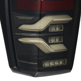 AlphaRex 16-21 Toyota Tacoma LUXX LED Taillights Blk w/Activ Light/Seq Signal - 680090