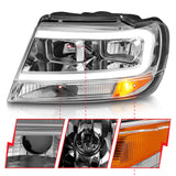 ANZO 1999-2004 Jeep Grand Cherokee Crystal Headlights w/ Light Bar Chrome Housing - 111538