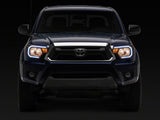 Raxiom 12-15 Toyota Tacoma Axial Series Headlights/Seq LED Bar- Black- Clear Lens - TT21848