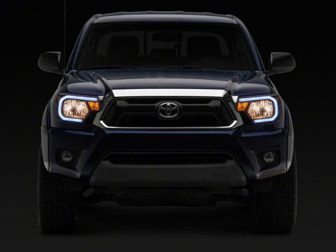 Raxiom 12-15 Toyota Tacoma Axial Series Headlights/Seq LED Bar- Black- Clear Lens - TT21848