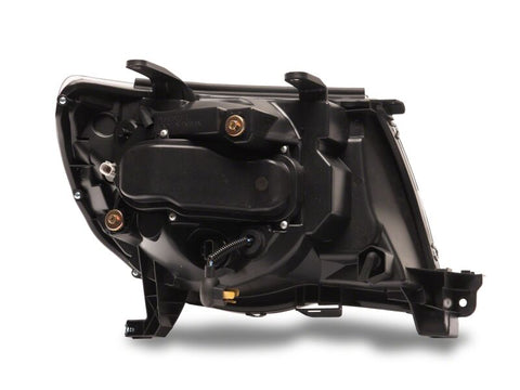 Raxiom 05-11 Toyota Tacoma Axial Series Switchback Projector Headlights- Black Housing- Clear Lens - TT23361