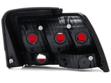 Raxiom 99-04 Ford Mustang Excluding 99-01 Cobra Tail Lights- Black Housing (Smoked Lens) - 49080