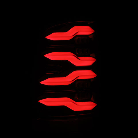 AlphaRex 09-18 Dodge Ram Luxx-Series LED Tail Lights Black w/ Activation Light & Sequential Signal - 640004