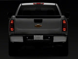Raxiom 01-13 Chevrolet Silverado/GMC Sierra 1500 Axial Series LED License Plate Lamps- Smoked - S122507