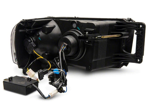 Raxiom 02-05 Dodge RAM 1500 LED Projector Headlights w/ SEQL LED Bar- Blk Housing (Clear Lens) - R131478