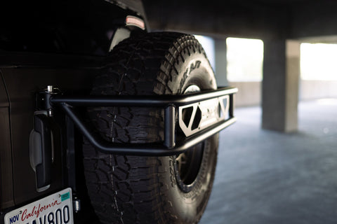 DV8 Offroad 21-23 Ford Bronco Spare Tire Guard & Accessory Mount - TCBR-01