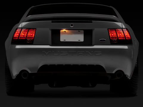 Raxiom 99-04 Ford Mustang Excluding 99-01 Cobra Tail Lights- Black Housing (Smoked Lens) - 49080