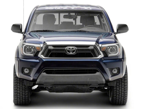 Raxiom 12-15 Toyota Tacoma Axial Projector Headlights w/ SEQL LED Bar- Blk Housing (Clear Lens) - TT21850