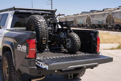 DV8 Offroad Truck Bed Universal Tire Carrier & Accessory Mount - UNBM-01