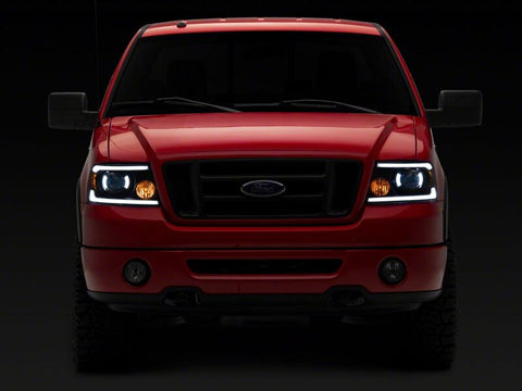Raxiom 04-08 Ford F-150 Axial Series Projector Headlights with LED Bar- Black Housing- Clear Lens - T566363