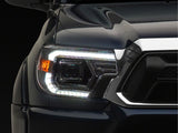 Raxiom 12-15 Toyota Tacoma Axial Series Switchback Projector Headlights- Chrome- Clear Lens - TT23360
