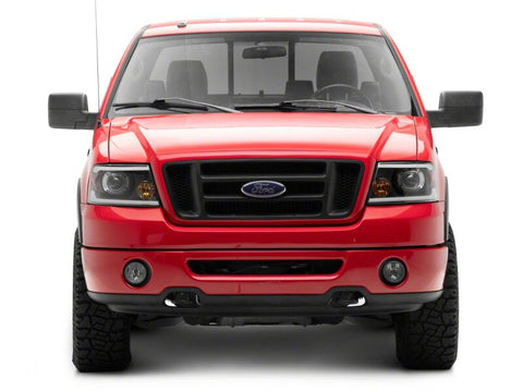 Raxiom 04-08 Ford F-150 Axial Series Projector Headlights with LED Bar- Black Housing- Clear Lens - T566363