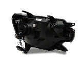 Raxiom 12-15 Toyota Tacoma Axial Series Projector Headlights w/ LED Bar- Blk Housing (Clear Lens) - TT21849