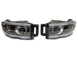 Raxiom 02-05 Dodge RAM 1500/2500/3500 Axial LED Projector Headlights- Blk Housing (Clear Lens) - R131477