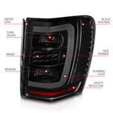 ANZO 1999-2004 Jeep Grand Cherokee LED Tail Lights w/ Light Bar Black Housing Smoke Lens - 311395