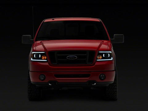 Raxiom 04-08 Ford F-150 Axial Series Projector Headlights w/ SEQL LED Bar- Blk Housing (Clear Lens) - T566364