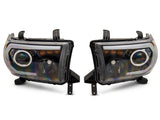 Raxiom 07-13 Toyota Tundra Axial Series Projector Headlights w/ LED Bar- Blk Housing (Clear Lens) - TU16006