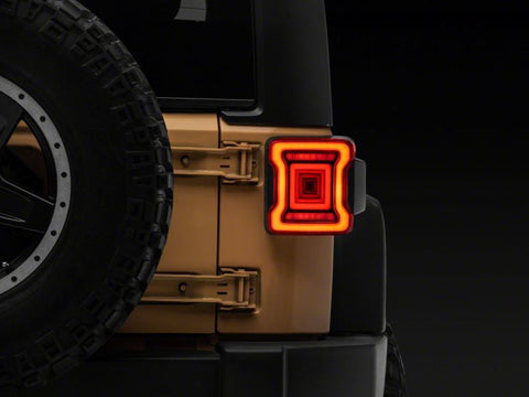 Raxiom 07-18 Jeep Wrangler JK Axial Series JL Style LED Tail Lights- BlkHousing- Red Lens - J164242