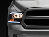 Raxiom 09-18 Dodge RAM 1500/2500/3500 Axial Series Headlights w/ LED Bar- Blk Housing (Clear Lens) - R131481