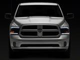 Raxiom 09-18 Dodge RAM 1500/2500/3500 Axial Series Headlights w/ LED Bar- Blk Housing (Clear Lens) - R131481