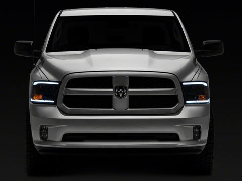 Raxiom 09-18 Dodge RAM 1500/2500/3500 Axial Series Headlights w/ LED Bar- Blk Housing (Clear Lens) - R131481