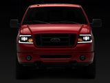 Raxiom 04-08 Ford F-150 Axial Series Projector Headlights with LED Bar- Black Housing- Clear Lens - T566363