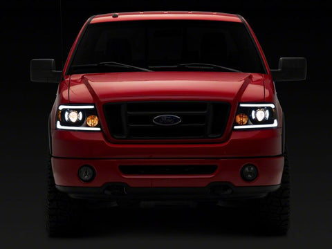 Raxiom 04-08 Ford F-150 Axial Series Projector Headlights with LED Bar- Black Housing- Clear Lens - T566363