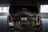 DV8 Offroad 21-23 Ford Bronco Spare Tire Guard & Accessory Mount - TCBR-01