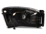 Raxiom 06-09 Dodge RAM 1500/2500/3500 Axial Headlights w/ SEQL LED Bar- Blk Housing (Clear Lens) - R131480