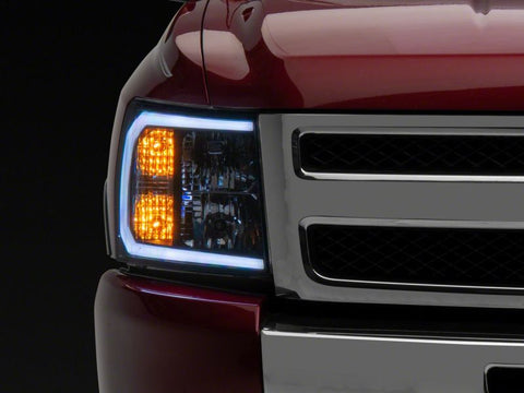 Raxiom 07-13 Chevrolet Silverado 1500 Axial Headlights w/ SEQL LED Bar- Blk Housing (Clear Lens) - S138004