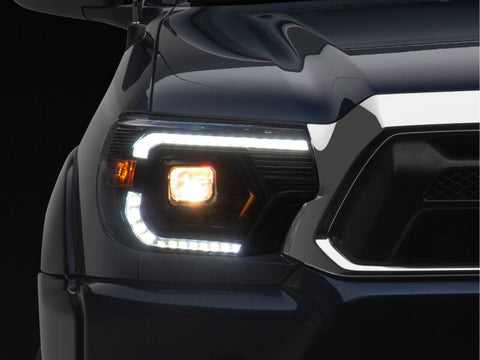 Raxiom 12-15 Toyota Tacoma Axial Series Switchback Projector Headlights- Black Housing- Clear Lens - TT23359