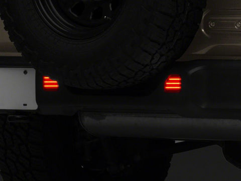 Raxiom 18-23 Jeep Wrangler JL Moab Rubicon Sahara Axial LED Rear Bumper Reflector Lights- Smoked - J134141-JL