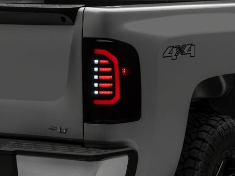 Raxiom 07-14 Chevrolet Silverado 1500 Axial Series LED Tail Lights- Blk Housing (Smoked Lens) - S150366