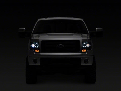 Raxiom 09-14 Ford F-150 Super White LED Halo Projector Headlights- Blk Housing (Clear Lens) - T542825