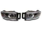 Raxiom 02-05 Dodge RAM 1500/2500/3500 Axial LED Projector Headlights- Blk Housing (Clear Lens) - R131477