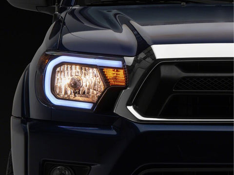 Raxiom 12-15 Toyota Tacoma Axial Series Headlights/Seq LED Bar- Black- Clear Lens - TT21848