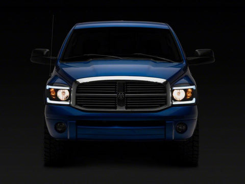 Raxiom 06-09 Dodge RAM 1500/2500/3500 Axial Headlights w/ SEQL LED Bar- Blk Housing (Clear Lens) - R131480