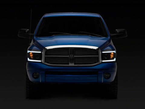 Raxiom 06-09 Dodge RAM 1500/2500/3500 Axial Headlights w/ SEQL LED Bar- Blk Housing (Clear Lens) - R131480