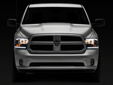 Raxiom 09-18 Dodge RAM 1500/2500/3500 Axial Series Headlights w/ LED Bar- Blk Housing (Clear Lens) - R131481