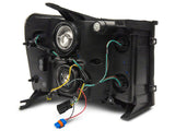 Raxiom 07-13 GMC Sierra 1500 Axial Series Headlights w/ LED Bar- Blk Housing (Clear Lens) - S531791