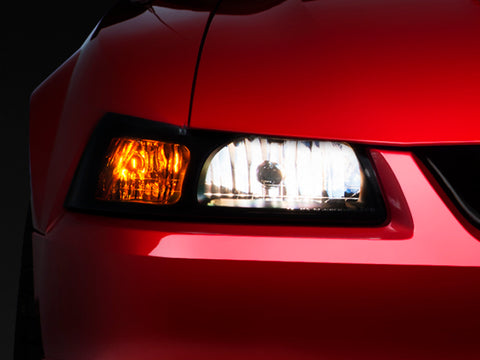 Raxiom 99-04 Ford Mustang Axial Series OE Style Headlights- Black Housing (Smoked Lens) - 49110