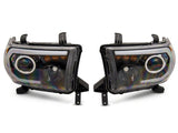 Raxiom 07-13 Toyota Tundra Axial Series Projector Headlights w/ LED Bar- Blk Housing (Clear Lens) - TU16006