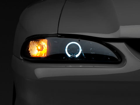 Raxiom 94-98 Ford Mustang LED Halo Projector Headlights- Black Housing (Smoked Lens) - 49119
