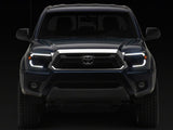 Raxiom 12-15 Toyota Tacoma Axial Series Switchback Projector Headlights- Black Housing- Clear Lens - TT23359