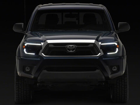 Raxiom 12-15 Toyota Tacoma Axial Series Switchback Projector Headlights- Black Housing- Clear Lens - TT23359