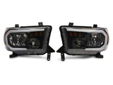 Raxiom 07-13 Toyota Tundra Axial Series Headlights w/ LED Bar- Blk Housing (Clear Lens) - TU16004