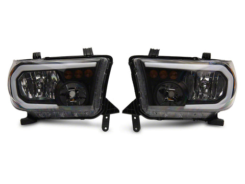 Raxiom 07-13 Toyota Tundra Axial Series Headlights w/ LED Bar- Blk Housing (Clear Lens) - TU16004
