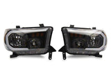Raxiom 07-13 Toyota Tundra Axial Series Headlights w/ SEQL LED Bar- Blk Housing (Clear Lens) - TU16005
