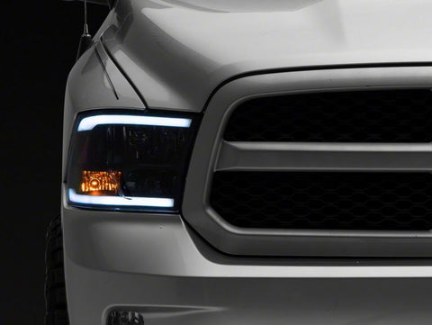 Raxiom 09-18 Dodge RAM 1500/2500/3500 Axial Headlights w/ SEQL LED Bar- Blk Housing (Clear Lens) - R131482